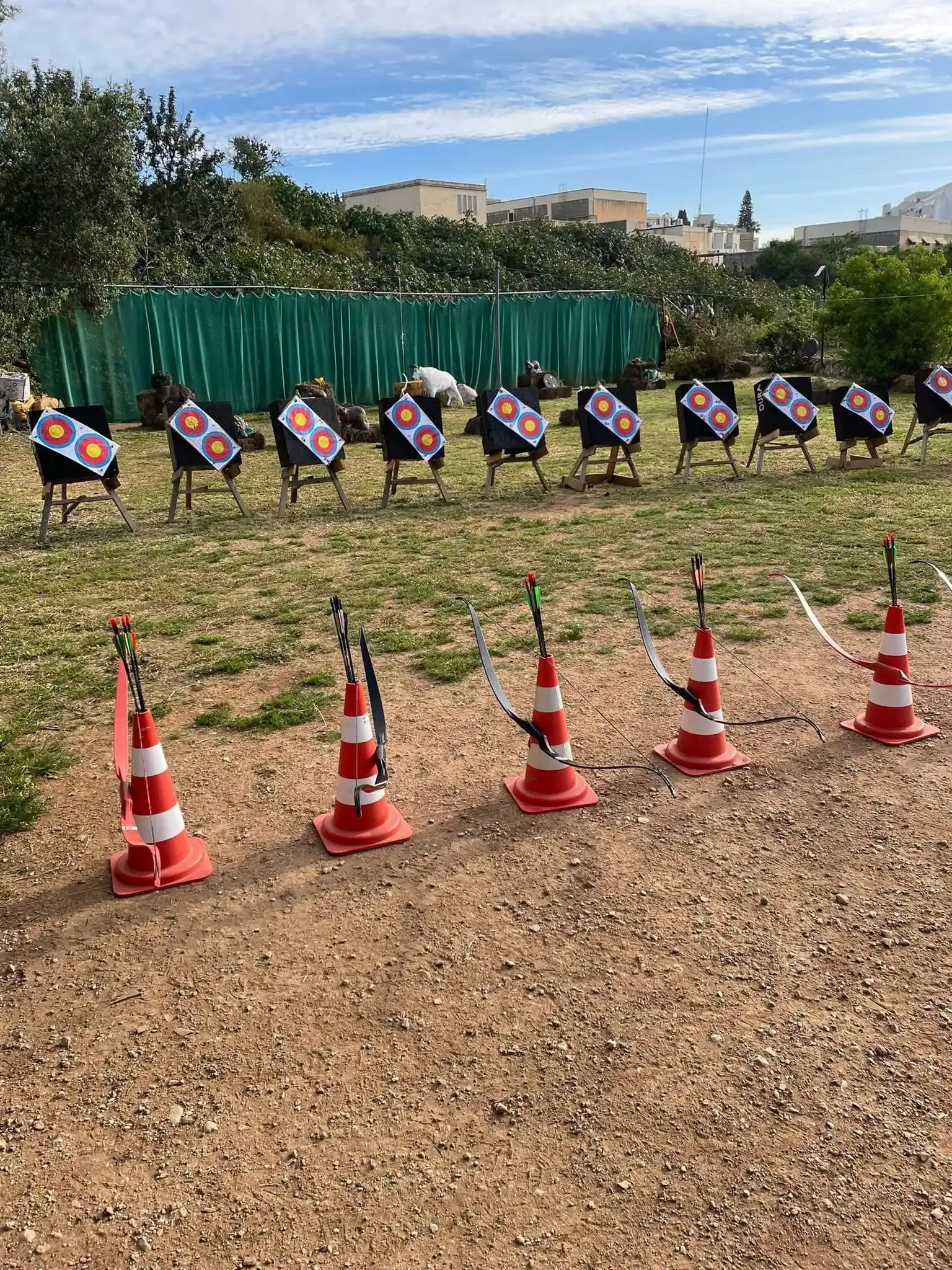 An archer taking aim during a range archery session at AIM Malta